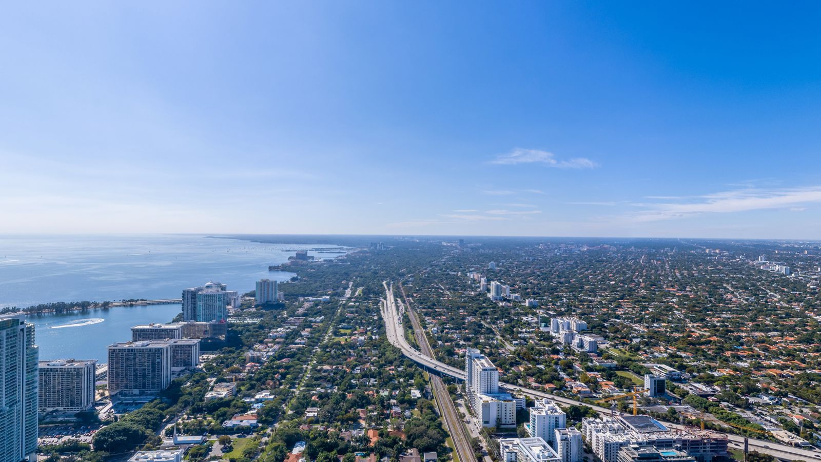Cipriani Residences Miami, view southwest over Simpson Park and Coconut Grove from about 750 feet, near the 69th floor, photographed from the site